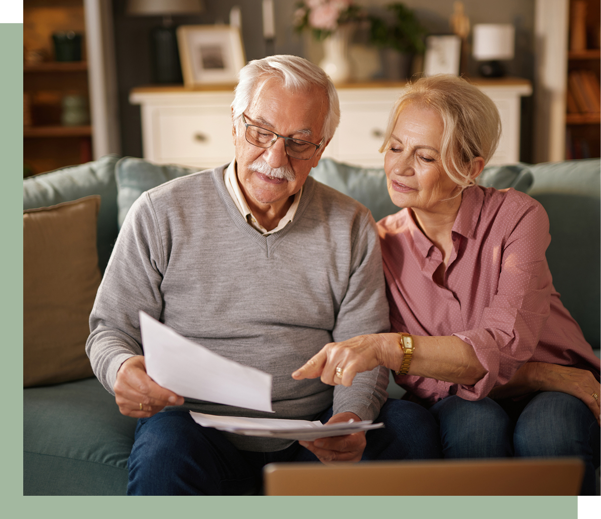 Older adults looking at financial papers