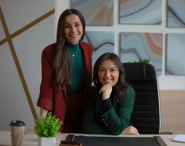 Professional women posing in office attire